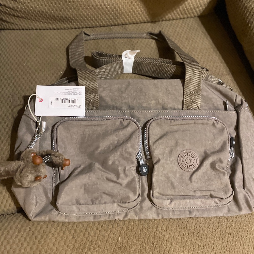 Beautiful Kipling purse new with tags! Retails for $104.00!